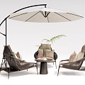 Comfortable Outdoor Chairs With Metal Frame And Fabric Cushions Under Large Umbrella And Side Table