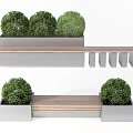 Modern Outdoor Bench with Wooden Slats and Potted Green Shrubs in Metal Planters