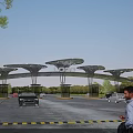 Modern Entrance Gate With Logo And Umbrella Shaped Canopies For Vehicles And Pedestrians