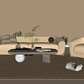 Beige Sofa And Coffee Table Set With Armchair Vase Books Rug And Green Plants