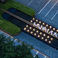 Garden Decorative Feature With Green Plants Lit Lights And MUMIAN Sign On Paved Ground