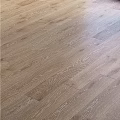 Light Brown Hardwood Flooring With Herringbone Pattern And Natural Texture
