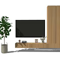 Wooden TV Stand With Mounted TV And Tall Cabinet Decorated With Plant And Ornaments