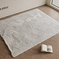 Fluffy Light Beige Square Rug on Wooden Floor with Open Book and Television