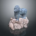 Blue Metallic Gorilla Sculpture Standing On Rocky Base With Detailed Features