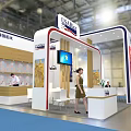USA Rice Exhibition Booth With Chef Preparing Food And Customer At Counter