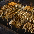 Outdoor Lights Artistic Grid Design Illuminated Night Public Square With Warm Glow And People Walking