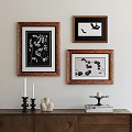 Botanical Paintings in Wooden Frames Hanging on Wall with Candles Vase and Books