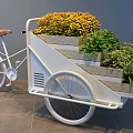 White Three Wheeled Bicycle Planter With Multi Tiered Colorful Plants