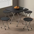 Black Folding Table With Four Stools Fruit Cup Near Window On Wooden Floor