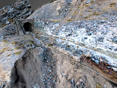 Stone Tunnel Entrance in Mountainous Terrain With Rocks Snow Patches and Slope Path 3d model