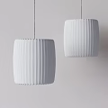 Two White Pleated Pendant Lights in Minimalist Interior With Light Grey Wall