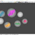 Multiple Transparent Glass Spheres With Colored Liquid Interiors On Blue Background