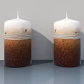 Two Decorative Candles With White Top Brown Bottom And White Stripes On Gray Background
