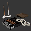 Decorative Ornament Set With White Candle Holders Brown Tray Black Books And Knotted Decor