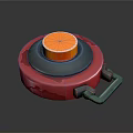 Red Circular Object With Orange Top Button Gray Middle Part And Handle Clasp