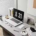 Modern Work Desk Setup With Laptop Coffee Cup Camera And Office Supplies