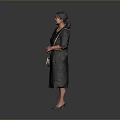 Woman in Black Dress Holding White Handbag Standing on Dark Floor with Gray Background