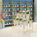 Stylish Garden Decor With Metal Frame Plant Stand And Various Potted Flowers