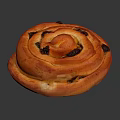 Golden Orange Sweet Spiral Roll With Raisins Shiny Surface On Dark Background