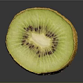 Fresh Sliced Kiwi Fruit With Yellow Skin Green Flesh And Black Seeds On Dark Background