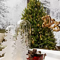 Cozy Living Room with Christmas Tree Fireplace Snowy View Outside Window Sofa Coffee Table