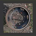 Old Rusty Metal Basin With Four Legs And Gravel Weeds Around Base