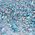 Various Colored Natural Stone Pebbles Spread Across Ground Surface With Rich Color Tones
