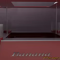 Red Square Table With Transparent Glass Top And Four White Spherical Decorations