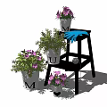 Potted Plants With Pink Flowers And U M Letters On Wooden Chairs Under Blue Sky