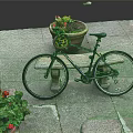 Bicycle Parked Near Stone Bench With Flower Pot And Red Blooms