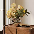 Metallic Silver Vase With Pale Yellow Roses And Green Leaves On Wooden Table With Books