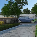 Blue Car Parked On Stone Pathway Surrounded By Green Trees Stone Wall And Yellow Flowers