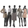 Black Fashion Mannequins Dressed in Various Clothing Outfits with Sweater Skirt and Printed Dress