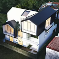 Modern Detached Villa With Large Glass Windows Black Frames White Exterior And Surrounding Trees