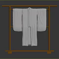 Soft White Robes Hanging On Golden Metal Clothes Rack Against Gray Background