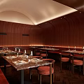 Elegant Restaurant Interior With Wooden Walls Marble Dining Tables Red Seats And Ambient Lighting