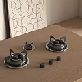 Cat Ear Shaped Gas Burners On Wooden Countertop With Black Knobs And Geometric Art