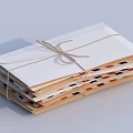 Stacked Twine Bound Decorative Envelopes Ornament Set with White Brown Red Blue Stamp Patterns