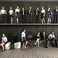 Group of Business Professionals Standing and Sitting in Professional Attire Against Dark Wall and Floor