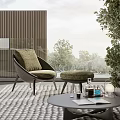 Round Outdoor Table With Wicker Chair Cushioned Seat Plants And Books Near Trees