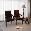 Brown Leather Armchairs With Floor Lamp Small Round Table And Rug On Wooden Floor