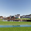 Scenic Waterfront Landscape With Wooden Boardwalk Residential Buildings And Moored Boats