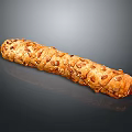 Freshly Baked Crusty Golden Brown Bread Stick Topped With Seeds And Nuts