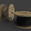Vintage Wooden Cable Reels With Black Cables And Wooden Spools Placed Flat And Sideways