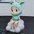 Cute Cartoon Baby In Light Green Horned Costume Sitting On White Spheres With Leaf Patterned Gray Wall