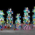 Vibrant Art Installation With Colorful Circular Elements Illuminated Towering Structures And Striped Sculptures 3d model