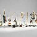 Stylish Clothes Display with Gold Racks Hanging Dresses Shirts and Accessories