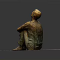 Man Sitting Bronze Statue With Arms Crossed Looking Up On Square Stone Slab