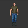 A Man Wearing Green T shirt Blue Jeans And Green Boots Standing Against Gray Background